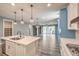 Spacious kitchen with white cabinets, stainless appliances, and backyard views at 5429 Blinding Lights St, North Las Vegas, NV 89081