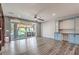 Spacious living room with grey hardwood floors and built-in shelves plus an outdoor patio at 5429 Blinding Lights St, North Las Vegas, NV 89081