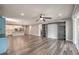 Open concept living room showcasing hardwood floors with seamless access to the kitchen at 5429 Blinding Lights St, North Las Vegas, NV 89081