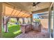 Outdoor kitchen with stainless steel gas grill and covered patio area with gazebo and outdoor seating at 5429 Blinding Lights St, North Las Vegas, NV 89081