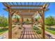 Inviting pergola with decorative lighting and landscaping creating a peaceful outdoor retreat at 5429 Blinding Lights St, North Las Vegas, NV 89081