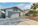 Charming single-story home with a two-car garage and well-maintained landscaping at 5553 Super Bowl Dr, Las Vegas, NV 89110