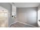 Inviting hallway featuring wood-look flooring and an open view to the living room with fireplace at 5553 Super Bowl Dr, Las Vegas, NV 89110