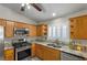 Well-equipped kitchen with granite countertops, stainless steel appliances, and ample cabinets at 5553 Super Bowl Dr, Las Vegas, NV 89110