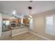 Bright kitchen with breakfast bar and stainless steel appliances, seamlessly connects to dining area at 5553 Super Bowl Dr, Las Vegas, NV 89110