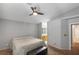 Comfortable main bedroom with en-suite bathroom and ceiling fan for added comfort at 5553 Super Bowl Dr, Las Vegas, NV 89110
