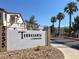 Terrasanta Condominiums community sign with desert landscaping and palm trees at 5655 E Sahara Ave # 2009, Las Vegas, NV 89142