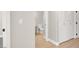 Hallway view showing white closet doors, and entrance to the bathroom at 5655 E Sahara Ave # 2009, Las Vegas, NV 89142