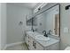 Bathroom featuring double sinks, modern fixtures, a large mirror, and clean lines, offering a functional design at 5710 E Tropicana Ave # 1216, Las Vegas, NV 89122