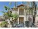 Two story home with balcony and wrought iron railing at 5710 E Tropicana Ave # 1216, Las Vegas, NV 89122