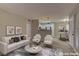 Inviting living room with neutral decor, wood floors, and an open layout that flows seamlessly to the kitchen at 5710 E Tropicana Ave # 1216, Las Vegas, NV 89122