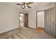 Spacious bedroom with carpeted floors, ceiling fan, and easy access to a walk-in closet and adjoining room at 5740 Winter Cherry St, Las Vegas, NV 89130