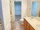 Bathroom view showing a shower, toilet and double sink vanity, plus view into walk-in closet at 6255 W Arby Ave # 239, Las Vegas, NV 89118