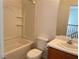 Bright bathroom featuring a tub, toilet, and vanity sink with modern fixtures and neutral tones at 6255 W Arby Ave # 239, Las Vegas, NV 89118