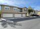 Charming townhouse exterior featuring multiple garages and neutral paint for a modern aesthetic at 6255 W Arby Ave # 239, Las Vegas, NV 89118