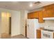 Kitchen showcasing wood cabinets and modern appliances at 6255 W Arby Ave # 239, Las Vegas, NV 89118