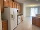 Kitchen showcasing wood cabinets and modern appliances at 6255 W Arby Ave # 239, Las Vegas, NV 89118