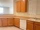 Kitchen featuring modern appliances, wood cabinets, and plenty of counter space at 6255 W Arby Ave # 239, Las Vegas, NV 89118