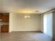Living room featuring gray floors, a chandelier, and natural light from the window at 6255 W Arby Ave # 239, Las Vegas, NV 89118