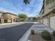 Charming street showcasing well-maintained homes, manicured lawns, mature trees and ample parking spaces at 6255 W Arby Ave # 239, Las Vegas, NV 89118