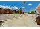 Spacious backyard featuring a tall wooden fence and a concrete perimeter for gardening at 629 N 16Th St, Las Vegas, NV 89101