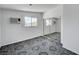 Neutral bedroom with a sliding door closet, large window and tile flooring at 629 N 16Th St, Las Vegas, NV 89101