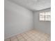 Bedroom with neutral walls and tiled floor features a window for natural light at 629 N 16Th St, Las Vegas, NV 89101