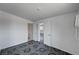 An open bedroom features doors to the bathroom and an additional room and has uniquely patterned dark floors at 629 N 16Th St, Las Vegas, NV 89101