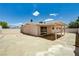 Exterior view of home showing spacious backyard, covered patio and block wall at 629 N 16Th St, Las Vegas, NV 89101