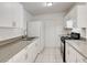 Well-equipped kitchen featuring white cabinets, a stainless steel sink, and modern appliances at 629 N 16Th St, Las Vegas, NV 89101