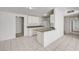 Bright kitchen with white cabinets, stainless steel appliances, and tile flooring at 629 N 16Th St, Las Vegas, NV 89101