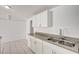 Kitchen featuring bright countertops and a double stainless steel sink at 629 N 16Th St, Las Vegas, NV 89101
