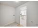 View into laundry room and kitchen from the hallway at 629 N 16Th St, Las Vegas, NV 89101