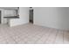 A bright living and kitchen space features tiled flooring and a breakfast bar connecting the spaces at 629 N 16Th St, Las Vegas, NV 89101