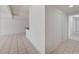 A large living space has tiled floors and white walls, with an open kitchen beyond a half wall to the rear at 629 N 16Th St, Las Vegas, NV 89101