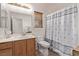 Bright bathroom with a single vanity and shower-tub combination at 6617 Johnny Love Ln, North Las Vegas, NV 89086