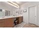 Bathroom with double sink vanity, large mirror and wooden cabinets at 6617 Johnny Love Ln, North Las Vegas, NV 89086