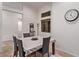 Cozy dining area featuring a table with four chairs and a window with natural light at 6617 Johnny Love Ln, North Las Vegas, NV 89086