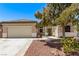 Charming single-story home with a well-manicured front yard and a two-car garage at 6617 Johnny Love Ln, North Las Vegas, NV 89086