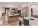 Spacious kitchen with granite countertops, modern appliances, and an open view to the living and dining areas at 6617 Johnny Love Ln, North Las Vegas, NV 89086