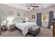 Cozy main bedroom with a ceiling fan and a large window with a plush bench at 6617 Johnny Love Ln, North Las Vegas, NV 89086