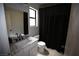 Modern bathroom featuring a marble vanity and a shower tub combo at 6812 Sheffield Dr, Las Vegas, NV 89108