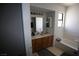 Bright bathroom featuring a single vanity and a shower-tub combo with a window at 6812 Sheffield Dr, Las Vegas, NV 89108