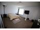Bright bedroom featuring neutral walls, carpet floors, and a window for natural light at 6812 Sheffield Dr, Las Vegas, NV 89108