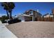 Charming two-story home featuring a spacious driveway, desert landscaping, and a well-maintained exterior at 6812 Sheffield Dr, Las Vegas, NV 89108