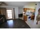 Bright kitchen with wood cabinetry, tile flooring, and an adjacent dining area for easy entertaining at 6812 Sheffield Dr, Las Vegas, NV 89108