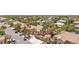 Beautiful aerial view of a home with a sparkling backyard pool, solar panels, and lush landscaping at 7301 Heggie Ave, Las Vegas, NV 89131