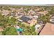 Gorgeous aerial view of a stunning home featuring a pristine swimming pool, lush landscaping, and solar panels at 7301 Heggie Ave, Las Vegas, NV 89131