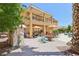 Expansive backyard with a multi-level patio, colorful seating, and lush landscaping at 7301 Heggie Ave, Las Vegas, NV 89131
