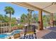 Outdoor balcony overlooking a pool, with decorative iron railings and comfortable seating arrangement at 7301 Heggie Ave, Las Vegas, NV 89131